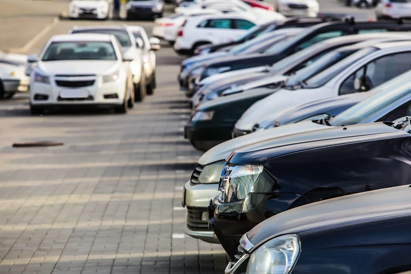 Rows of parked vehicles in a lot, junk car removal service in Cambridge, Ontario